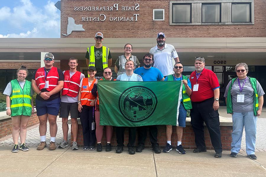 Pictured left to right while attending New York Hope in August are, in the front row, Dr. Lauren Leach-Steffens, Dr. Mark Corson, Richard Leach-Steffens, Tim Davis, Will Thornsberry, Cheyenne Martin, Kaelyn Simnitt, Will Roberts, Ewan Mills and Kelsie Krier. In the back row are Travis Surprise, Mackenzie Baker and Michael Meyers. (Submitted photo)